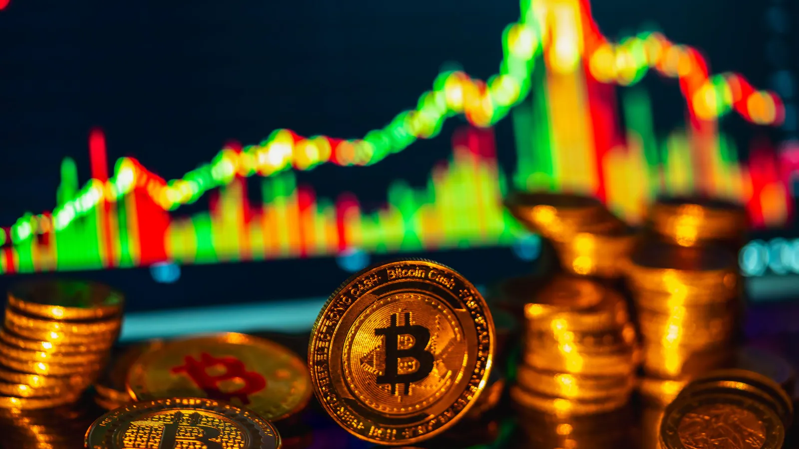 Bitcoin coins in front of a price chart
