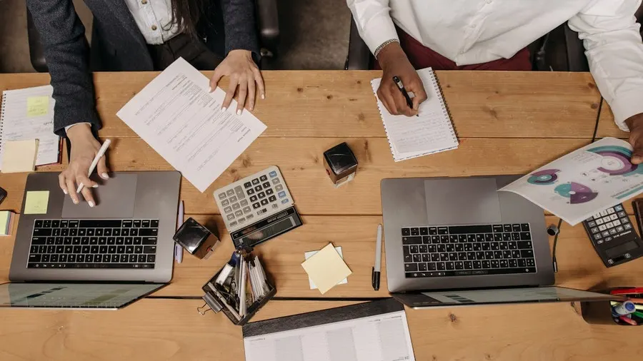 Trader comparing account types at a desk