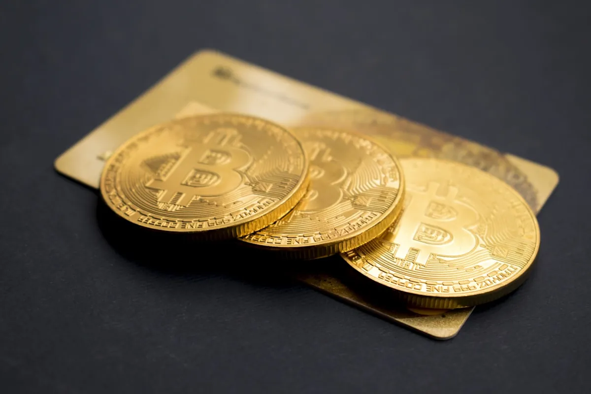 A pile of gold and silver crypto coins representing prop firm payouts and profit splits