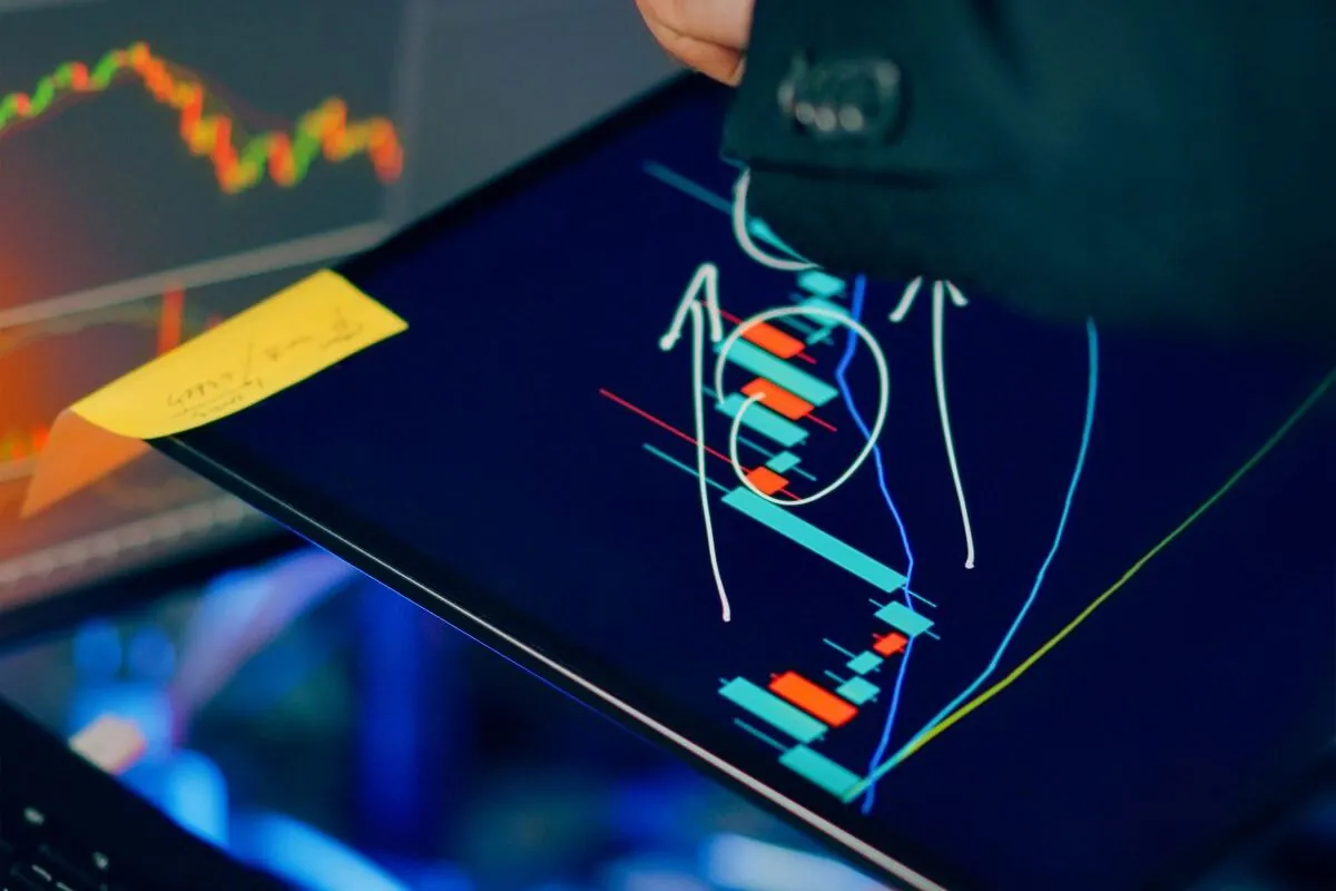 A futures trader monitoring a live index chart, the kind of CME market a Lucid Trading account is built around