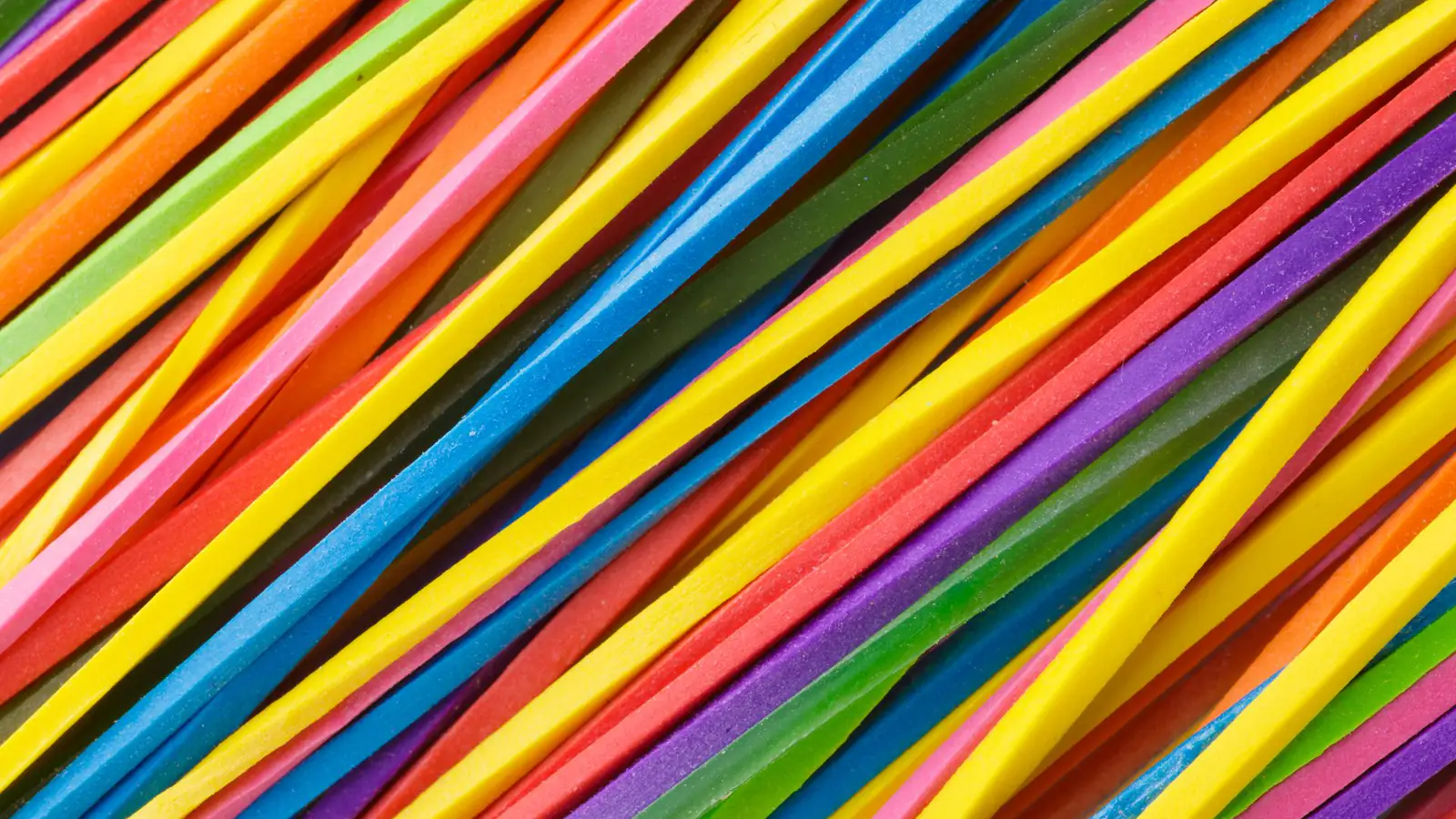Colourful elastic bands stretched in parallel lines