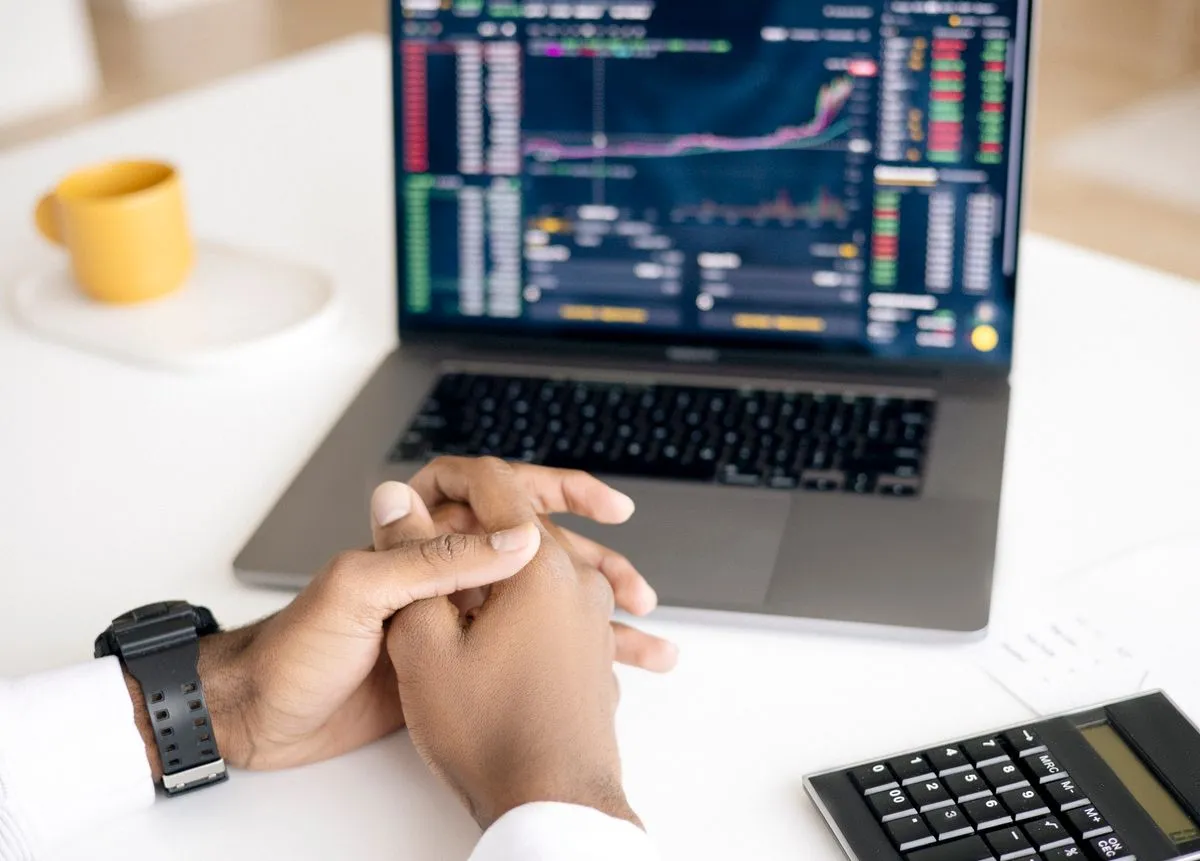 Trader comparing prop firm rule documentation across multiple firm websites before purchasing a funded account challenge evaluation