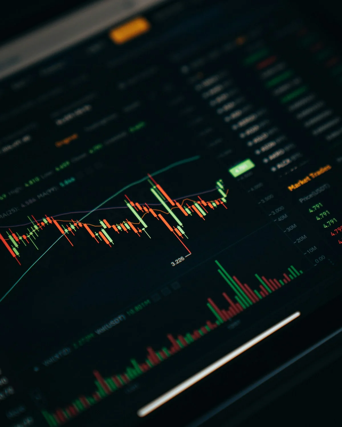 Prop trader checking the prop firm rules document on a laptop before starting an evaluation, with drawdown limits and daily loss calculations open on a second screen