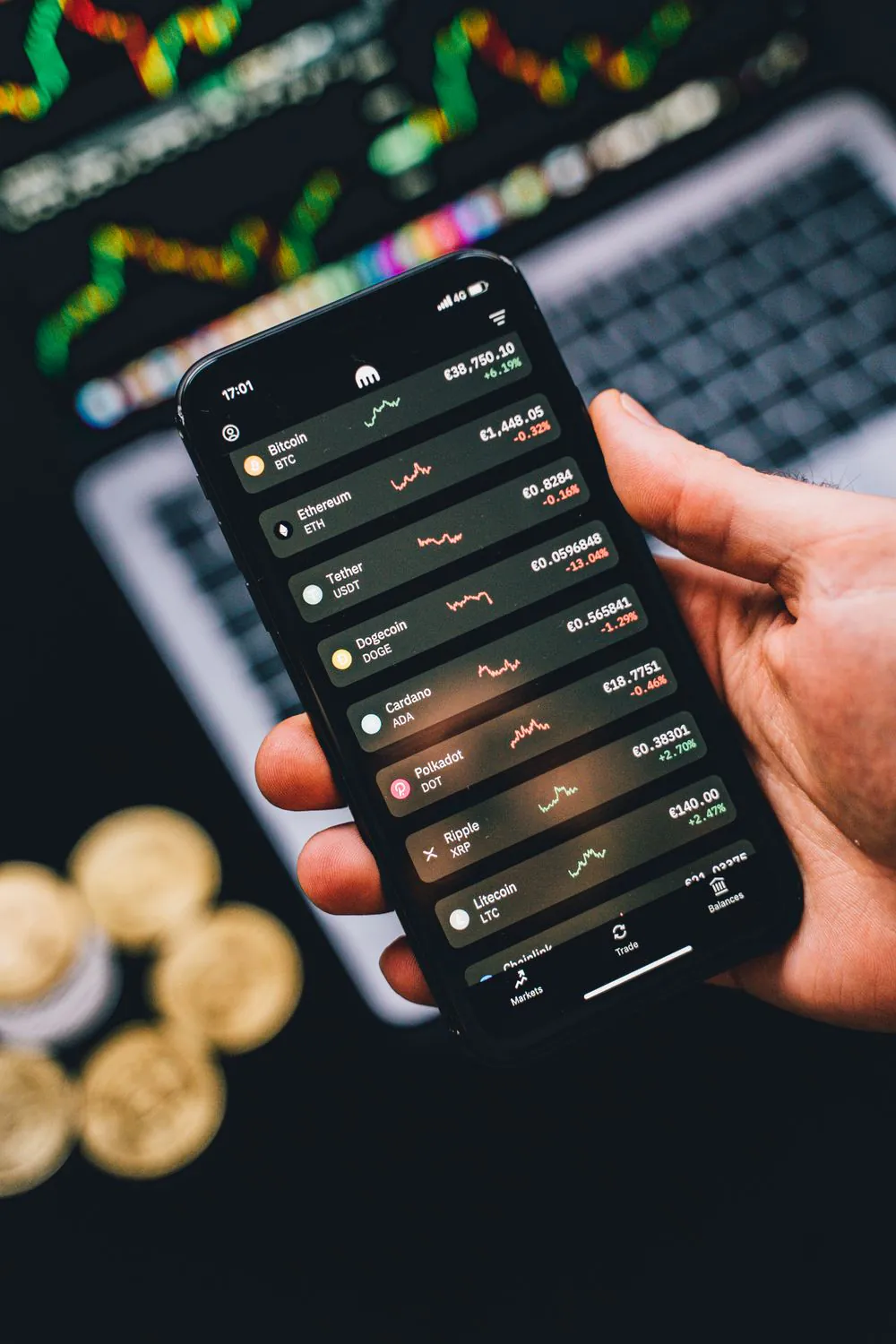 A crypto trading app showing digital-asset prices, including Tether, the issuer of tokenized gold XAUT