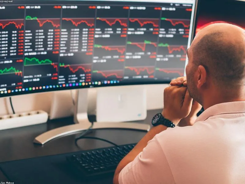 Professional crypto trading setup with multiple monitors